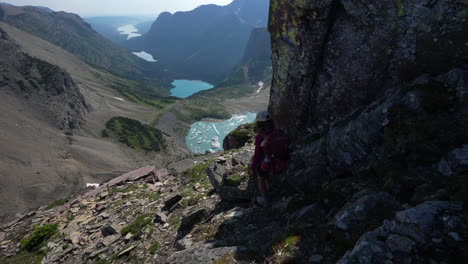 Young-Female-Hiker-With-Backpack-on-Scenic-Lookout-Above-Glacial-Lakes