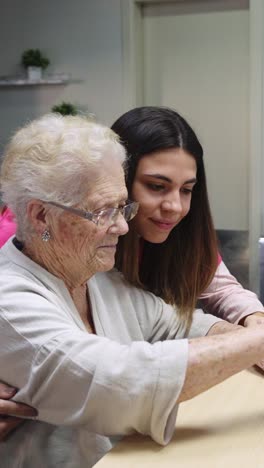 elderly woman with her young granddaughter