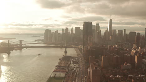 aerial shot over fdr drive towards new york city financial district