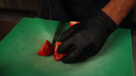 chef cutting tomatoes