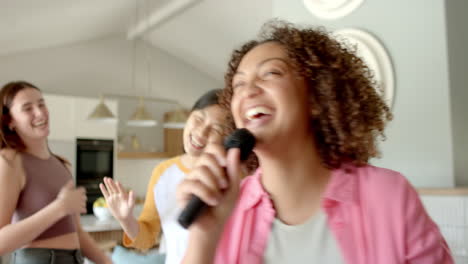 singing into microphone, woman enjoying karaoke with friends at home party
