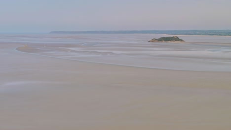 panoramic view from the tower of mont saint michel on the english channel at low tide