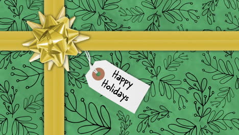 happy holidays text animation over green gift wrap with golden ribbon and bow