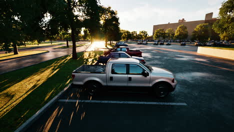 sunset casts long shadows on parked trucks in a serene urban lot