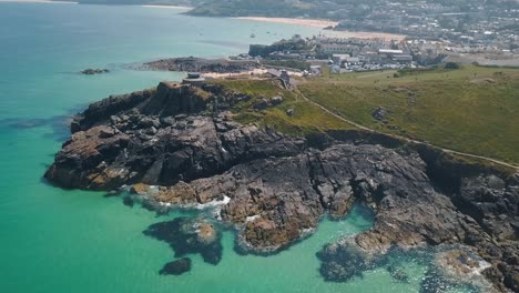 aerial: beautiful cornwall coastline, st ives tourist destination town, uk