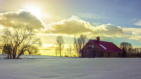 Clouds-race-through-winter-sky,-brilliant-colors-by-setting-sun,-timelapse