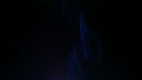 colors smoke in dark background