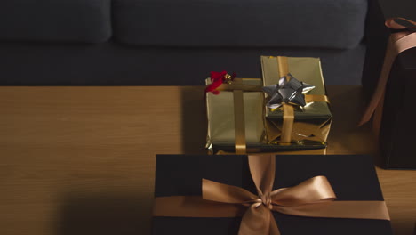 close up of gift wrapped presents on table in lounge at home 8