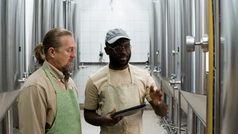 two men in a factory