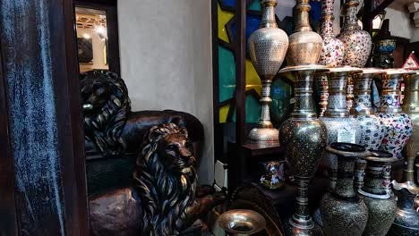 decorative jars and lion statue in dubai market