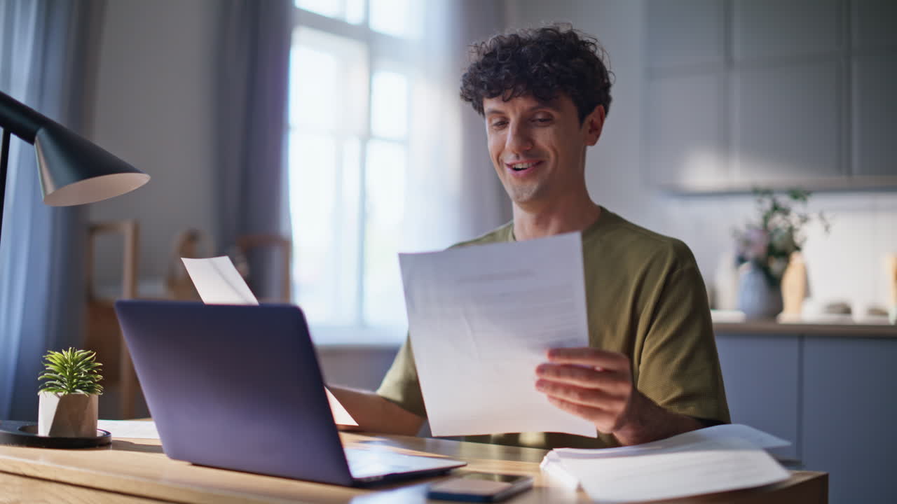 Online worker typing computer analyzing documents at remote workplace closeup