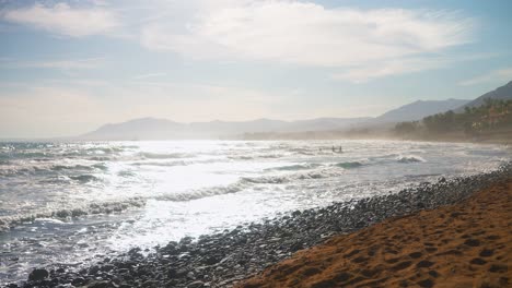 beautiful beach scene with waves crashing on rocky shore
