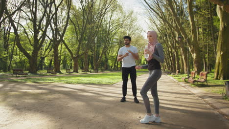 couple exercising in a park