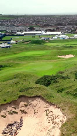 advancing social ratio aerial video of royal portrush golf course in county antrim, northern ireland, uk on a sunny day. produced in 1080x1920 vertical ratio, 60fps and with rec709 color