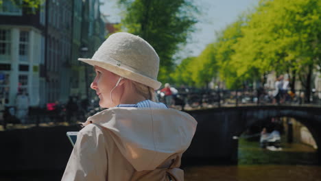 woman with headphones in amsterdam