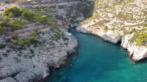 aerial drone photo of iconic natural volcanic tropical fjord of porto limnionas with caves and crystal clear emerland seascape, zakynthos island, ionian, greece