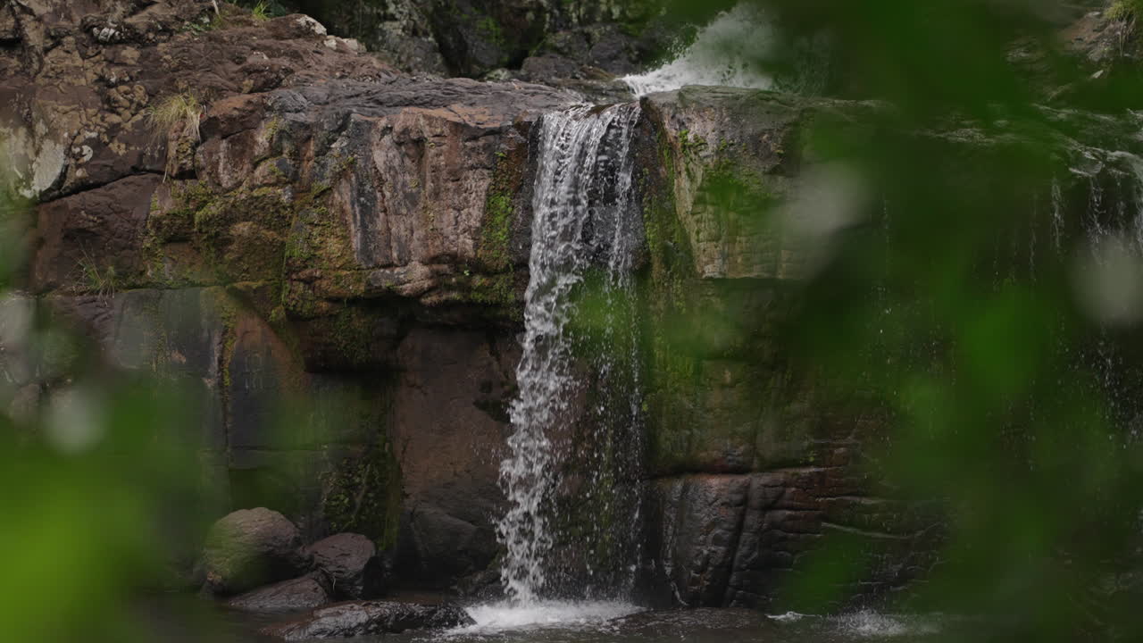 Establishing tilt up along Salto El Yerba waterfall, forest atmosphere, surrounded by greenery in Misiones Argentina