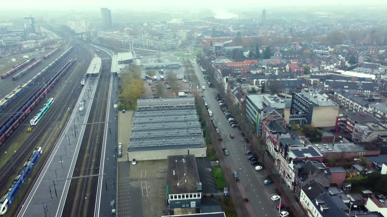 Aerial View of Urban Area with Trains and Buildings