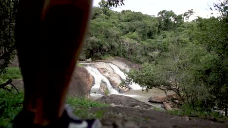 Close-up-walking-into-a-waterfall-in-slow-motion