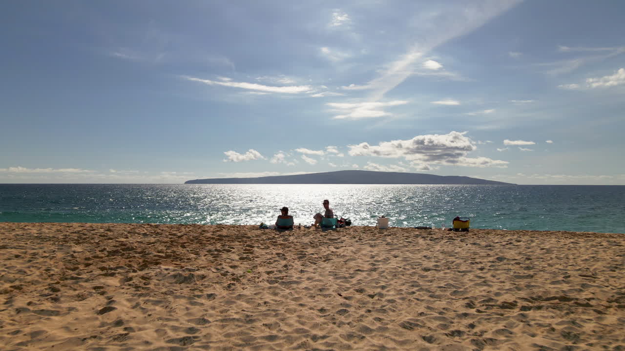 Vacation in paradise concept, friends on beach by turquoise ocean