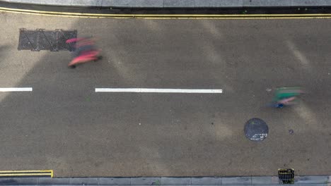 Birds-eye-view-time-lapse-of-colorful-marathon-runners-on-road