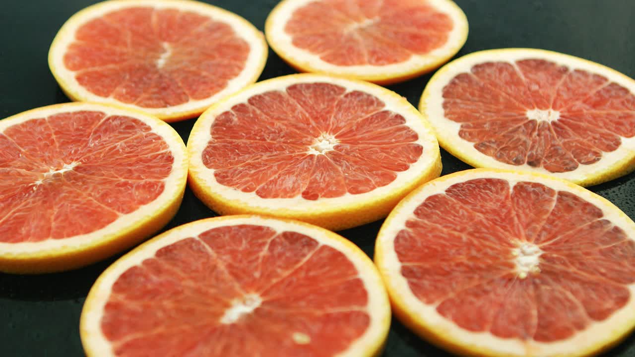 Slices of grapefruit on table 