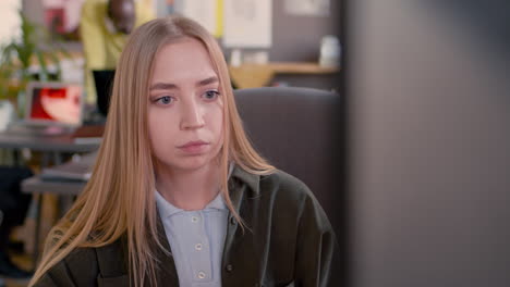 Concentrated-Young-Young-Woman-Looking-At-Computer-Monitor-In-An-Animation-Studio