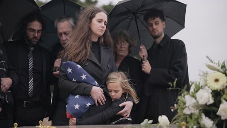 Funeral,-family-and-sad-people-with-American-flag