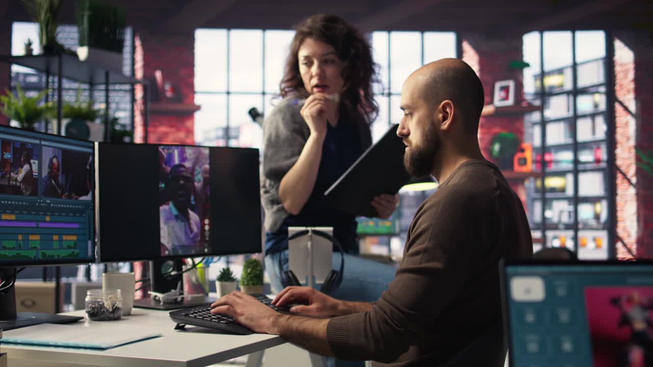 Team discusses content strategy and trends while reviewing footage on computers