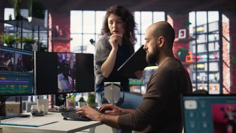 team discusses content strategy and trends while reviewing footage on computers