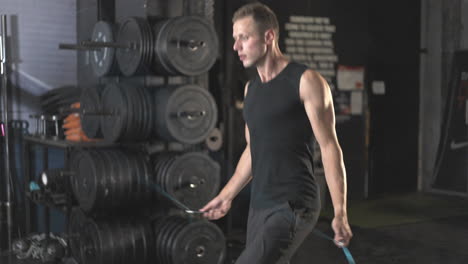 man jumping rope in gym