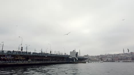 harbor secenery in karaköy next to famous galata bridge of istanbul