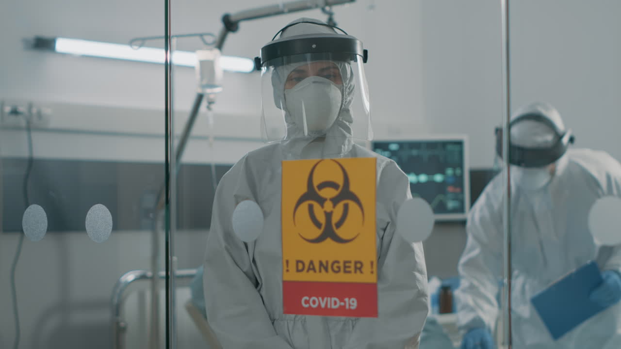 Portrait of nurse in hazmat suit staying in quarantine zone