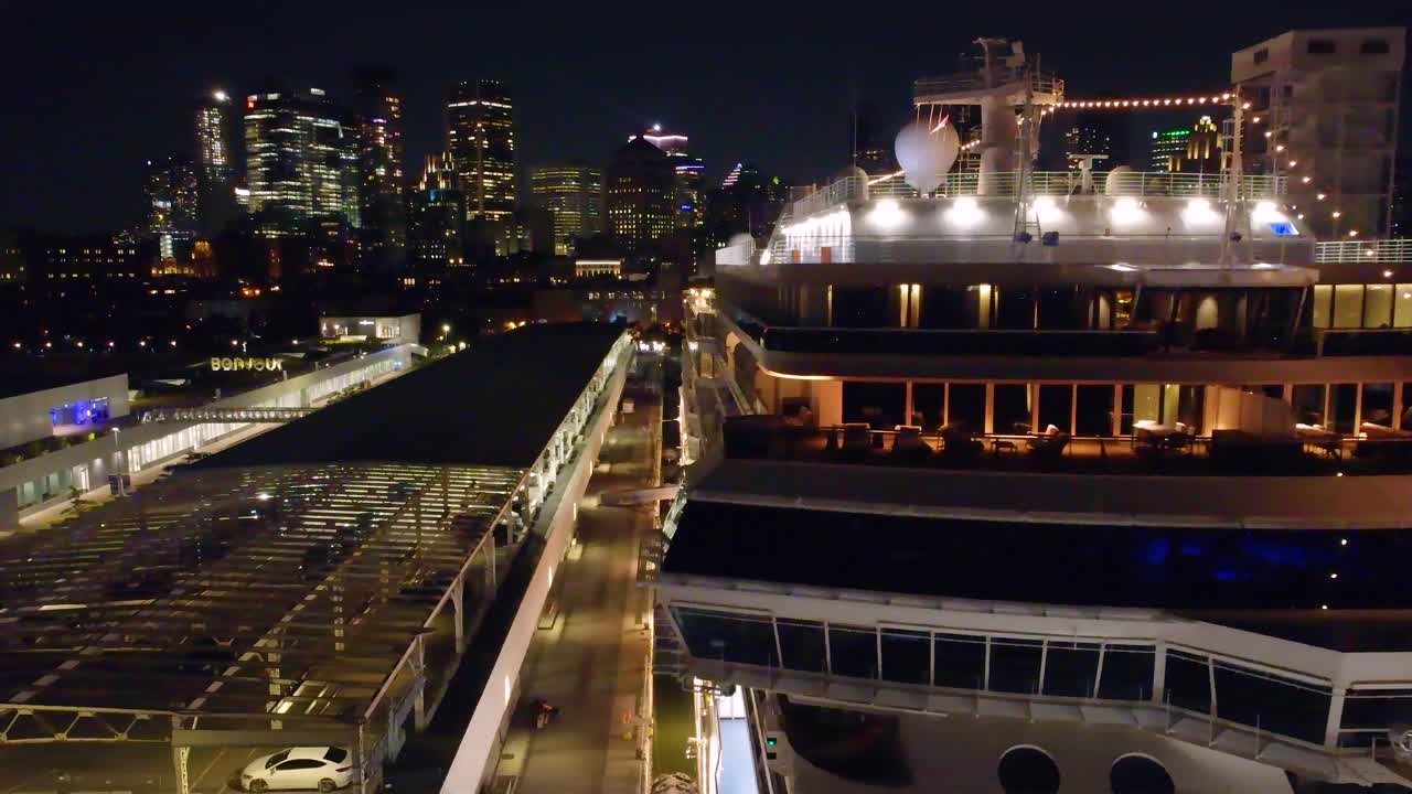 Seven Seas Grandeur luxury ferry in Montreal with skyscrapers in background