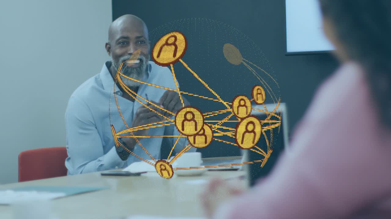 Business manager picking up pen and speaking as orange network icons showing global links rotating