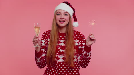 Lovely-girl-in-Christmas-Santa-sweater-dancing-with-bengal-sparklers-fireworks-and-champagne-glass