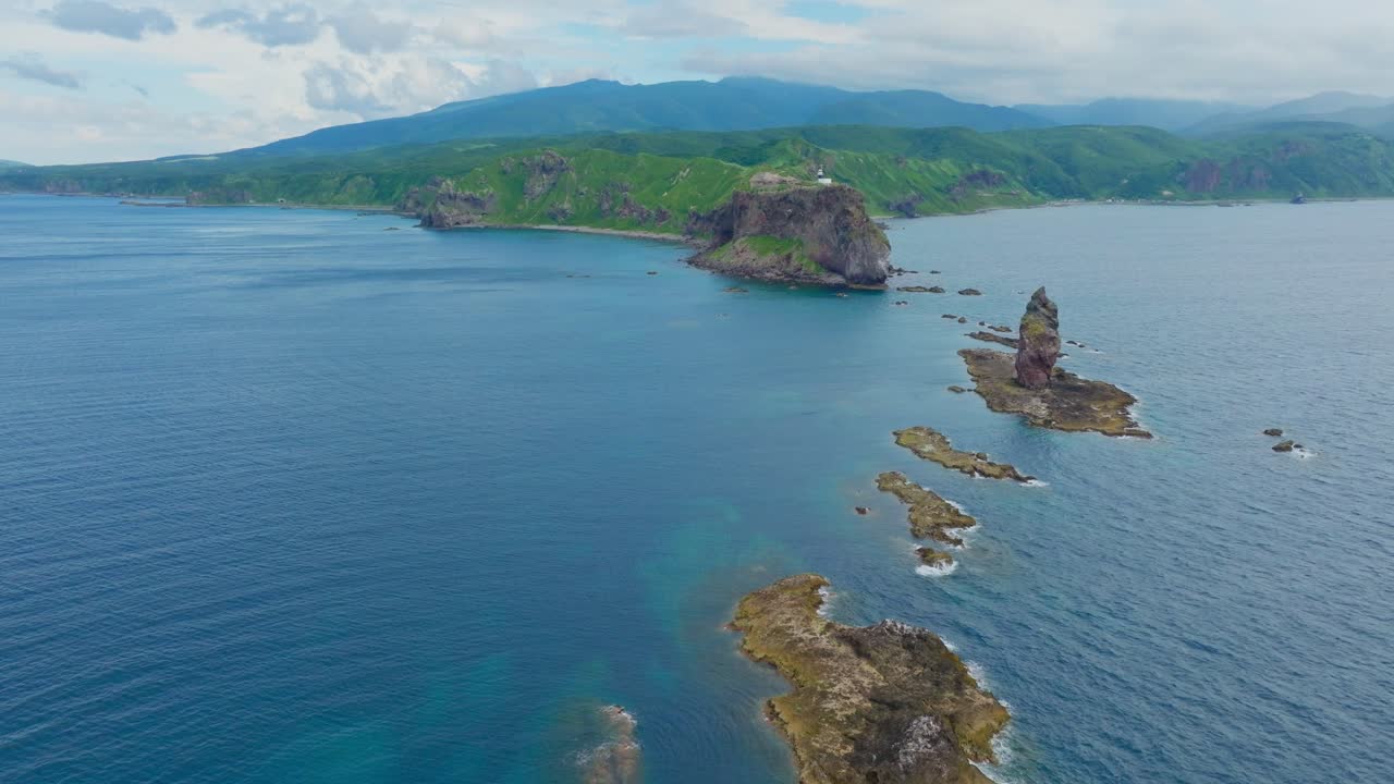 Aerial establishing drone reveals secret stone islands in Japanese Sea at Shakotan Hokkaido, famous rocks