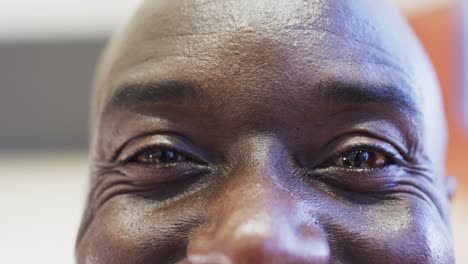 close up portrait of male african american basketball player eyes, in slow motion