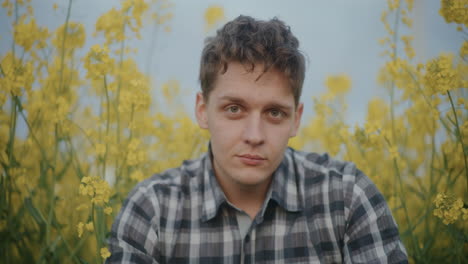 Farmer-Amidst-Yellow-Flowers-Blooming-In-Farm