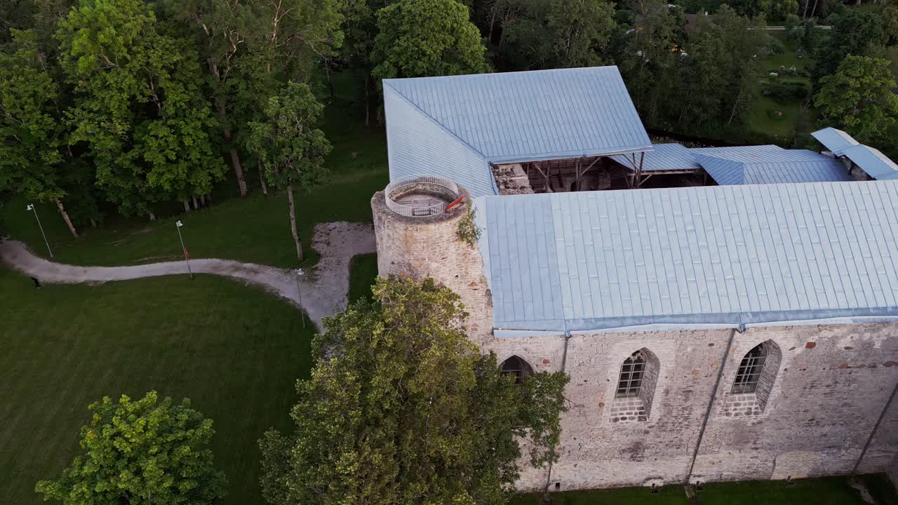 Aerial view of Padise Monastery reveals the preserved medieval Cistercian structure with stone walls and towers set in rural Harju County Estonia offering a glimpse into centuries of history
