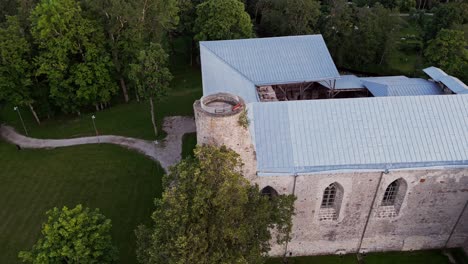 aerial view of padise monastery reveals the preserved medieval cistercian structure with stone walls and towers set in rural harju county estonia offering a glimpse into centuries of history