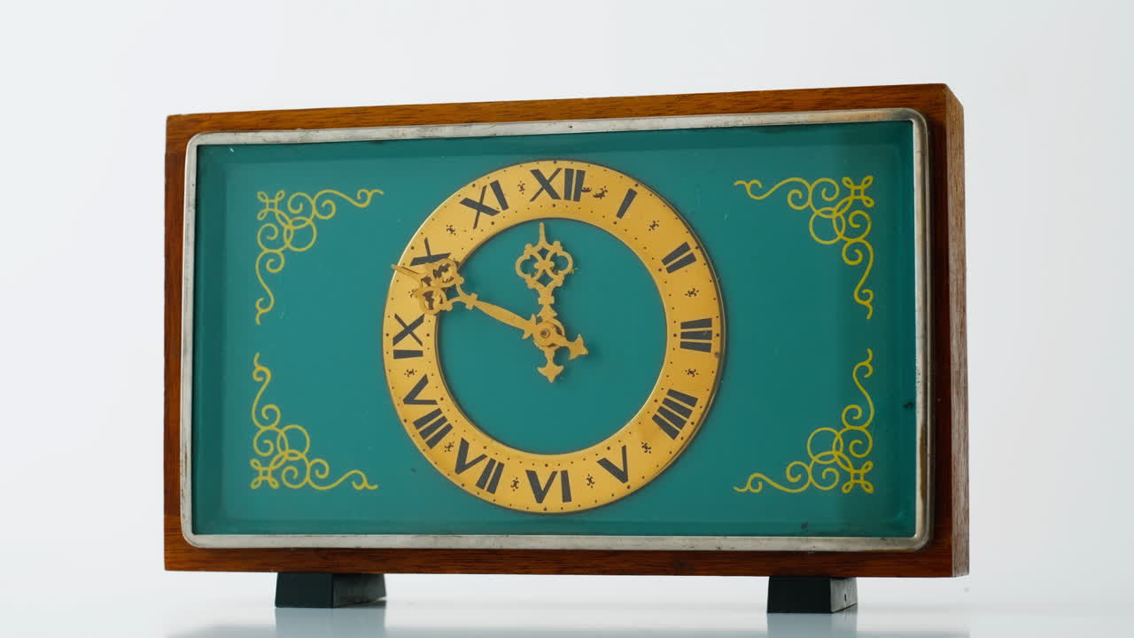 Vintage desk clock standing at surface closeup. Exquisite retro gadget showing