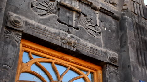 Yuriy-Gyumri,-Armenia---Antique-Relief-Sculptured-On-The-Wall---Close-up-Shot