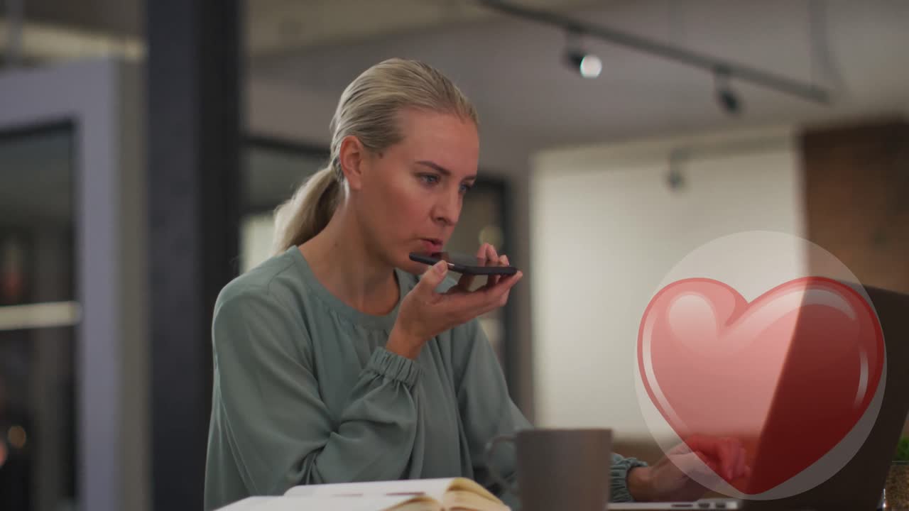 Animation of red hearts over caucasian businesswoman using smartphone