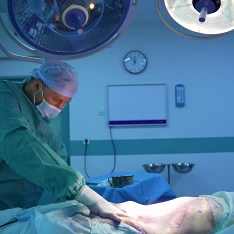 surgery of liposuction in operating room. doctor performing cosmetic surgery with medical tools for removing fat from patient's body