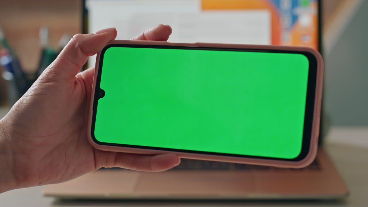 Unknown student browsing mockup mobile phone at office desk closeup. Woman hands
