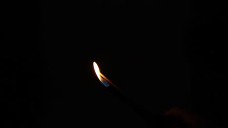 sequence showing a sparkler burning from ignition to end