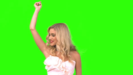 Attractive-woman-dancing-in-wedding-gown-on-green-screen