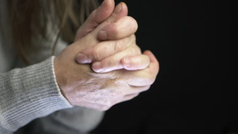 hands trying to keep warm in cold weather close up shot