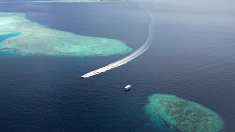 aerial view of a boat cruise the indian ocean tourist guided tour in maldives coral reef maafushi inhabited islands of kaafu atoll